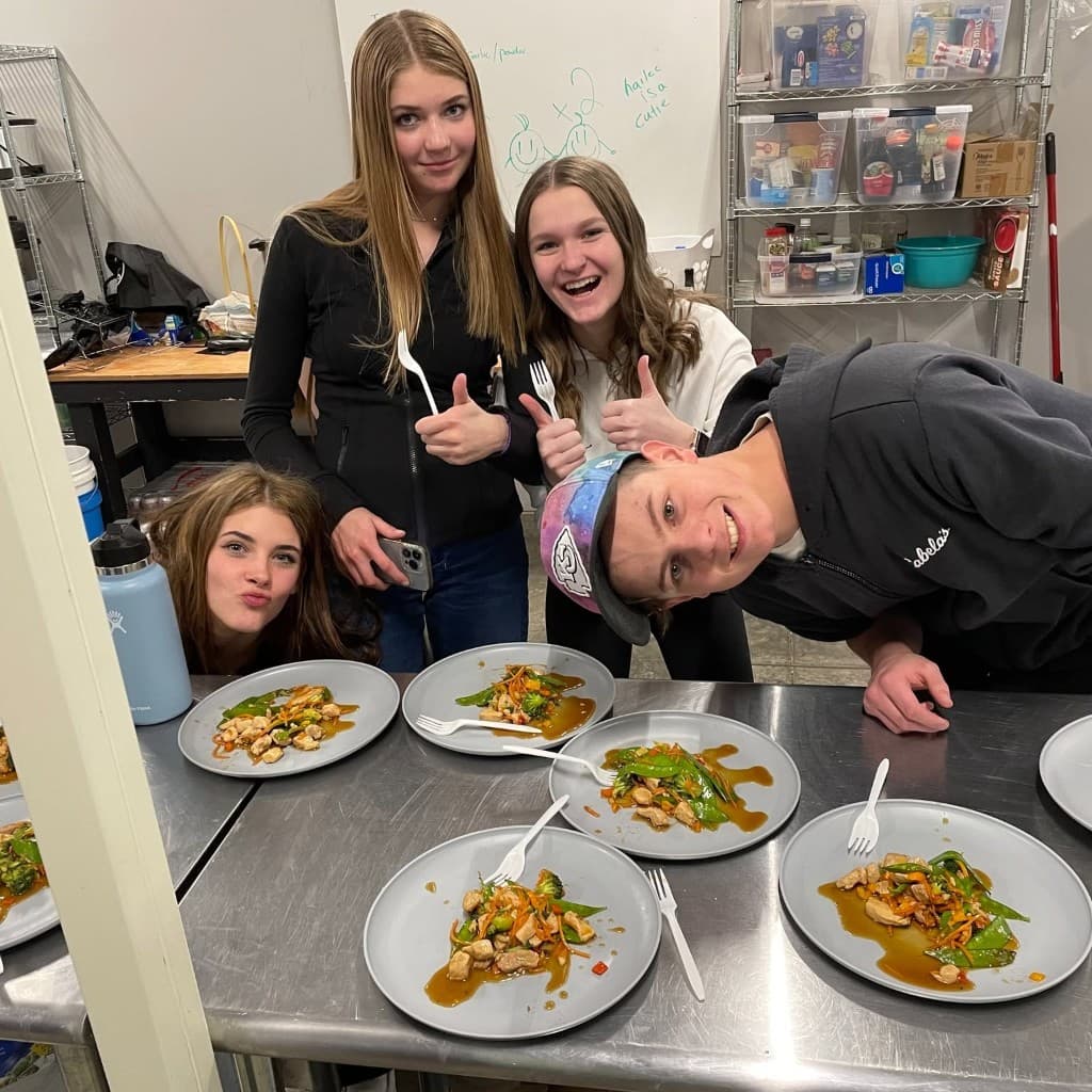 Culinary Nutrition and Culinary Rx — Green Thumb Initiative youth showing plates from a cooking program
