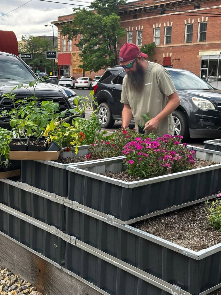 Therapeutic Horticulture Programs — Green Thumb Initiative volunteer planting in raised beds during a therapeutic horticulture program in Southern Colorado